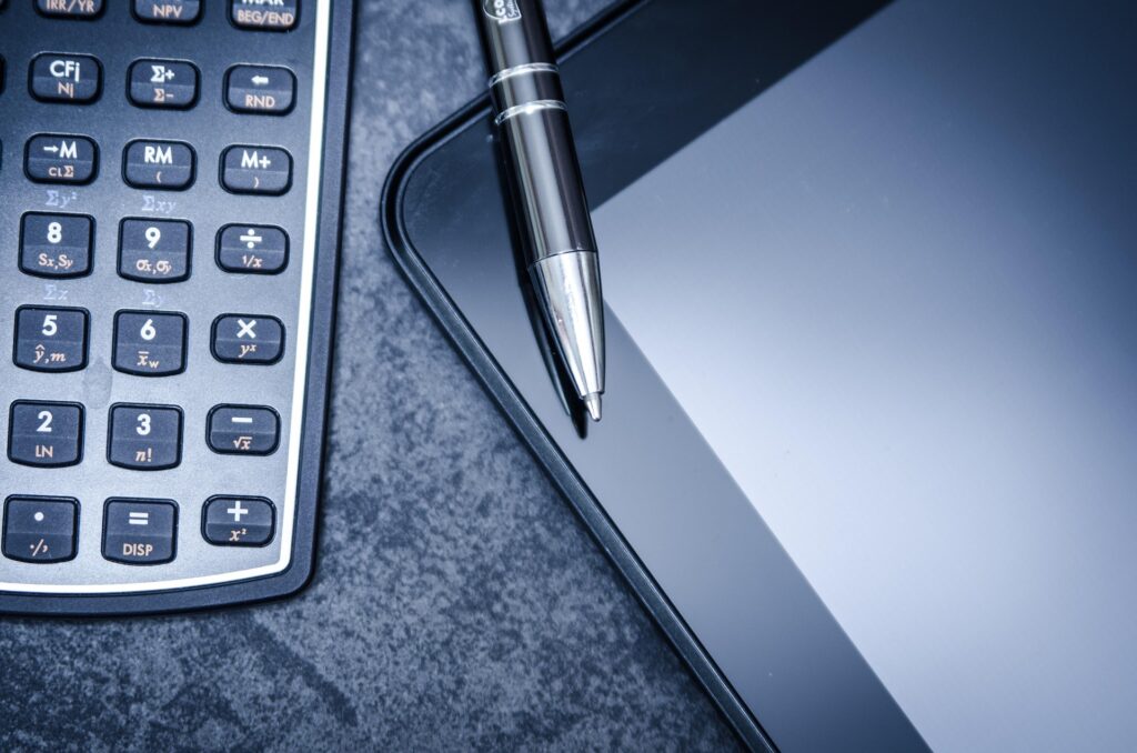 a calculator, pen and a mobile phone